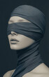 © rjankovsky - A woman's face is obscured by a scarf