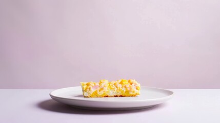 Wall Mural - A Partially Eaten Yellow and Pink Dessert Bar on a White Plate