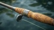 © Maria - Vintage split cane fly fishing rod is shown with a lake in the background