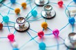 © Iftikhar alam - Stethoscope Connected to Colorful Pins, Showcase the intricate web of referrals and consultations between primary care physicians and specialists