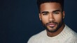 © LKT - Modern style beauty photography featuring Black African American male in crew neck sweater, close-up focus on facial features, grooming, and short tight curls