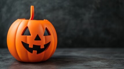 carved pumpkin jack-o'-lantern halloween decoration on dark background