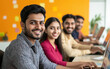 © PRASANNAPIX - indian corporate office staff smiling while working at office