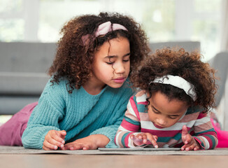 Sticker - Sisters on floor, home and relax with tablet, typing and playing online games in living room. Kids, apartment and girls on carpet, tech and social media with digital app for fun and scroll for ebook