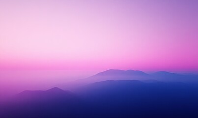 Wall Mural - A beautiful mountain range with a pink sky in the background