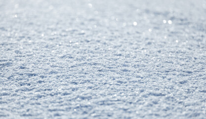 Wall Mural - Shiny snow surface on a sunny winter day, natural background photo