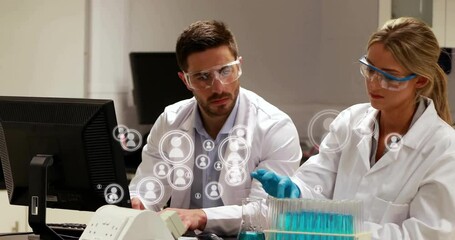 Wall Mural - Working with computer and test tubes, scientists in lab coats analyzing data animation