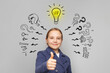 © millaf - Confident happy child girl with light bulb and question marks on white background. Education and idea concept