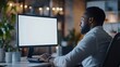 © Generative AI - Unrecognizable black businessman using computer with empty blank screen sitting at workplace in office offering space for mockup on monitor Male CEO showing place for online ad : Generative AI