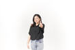 © Sino Images Studio - Young Asian woman showing thumbs up, okay or agree concept wearing Black t-shirt and jeans isolated on white background
