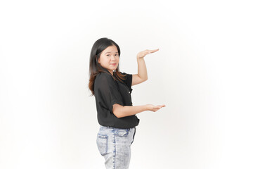 Wall Mural - Young Asian woman Measuring and Showing Big Product wearing Black t-shirt and jeans isolated on white background