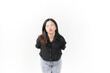 © Sino Images Studio - Young Asian woman blowing kiss wearing Black t-shirt and jeans isolated on white background