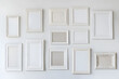 © Oksana_Latysheva - Collection of Various White Picture Frames on White Wall Mock up