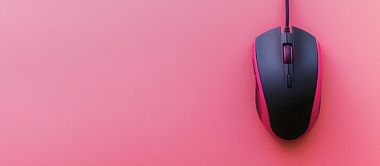 Top view of a wired mouse and mousepad placed on a pink background with space available for text in the image. Copy space image. Place for adding text and design