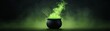 © Achirawee - A neon light display of a cauldron bubbling with bright green neon light, with a dark background and significant copy space for additional content.