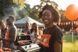 © spyrakot - High School Graduates Celebrating College Acceptances with Cookout in Park