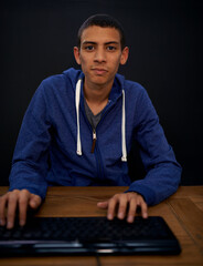 student, portrait and man working on keyboard, typing on assignment for university. studying, progra