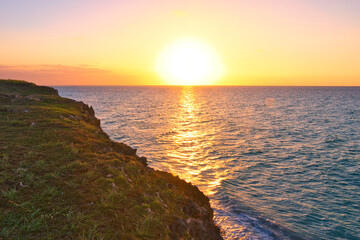 Wall Mural - Varadero, CUBA - April 08, 2023: Varadero Beach.The famous beach of Varadero in Cuba with a calm turquoise ocean and clouds in the sky. Sunset time