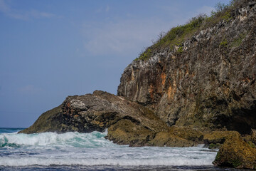 Wall Mural - A rocky cliff overlooks the ocean