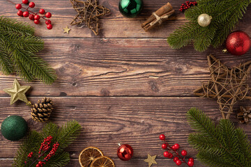 Sticker - Top view of a rustic wooden table adorned with pine branches, red berries, star decor, and holiday ornaments creating a festive Christmas atmosphere