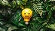 © 69 - Happy-faced yellow light bulb on a vibrant green plants background, flat lay, symbolizing bright ideas and positivity.