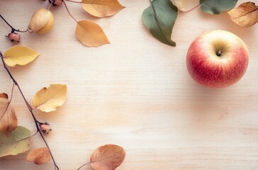 Sticker - Autumn Leaves and Apple on Wooden Background