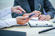 © Worapon - Two lawyers consult in a modern office, presenting compelling arguments and demonstrating their expertise, trying to win a case with their legal acumen and persuasive skills.