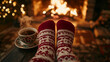 © Катерина Спіжевска - Close-up of feet in red and white woollen socks by the Christmas fireplace, soft firelight illuminating the room