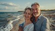 © LukaszDesign - Elderly couple embraces joy and love by the seaside, enjoying their vacation. They share laughter on a romantic outdoor adventure, exploring nature and relaxing together