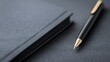 © JoxyAimages - An elegant black notebook and a pen with a golden tip displayed on a dark surface, showcasing a high-quality and professional appearance, ideal for notes, writing or business.