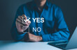 © Supatman - Decision-Making with Yes or No Choice Checkbox, A hand selecting 'Yes' from a digital checkbox interface, symbolizing decision-making, approval, or agreement in a professional or survey context.