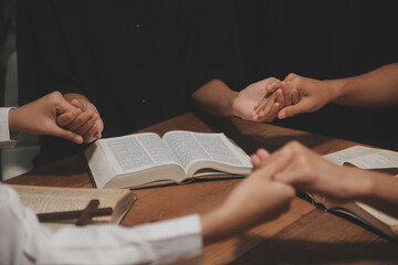 Wall Mural - Christian group are praying to god with the bible and sharing the gospel. Concept of faith for god.