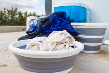 Poster - Washing laundry outdoor at caravan