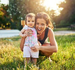 Wall Mural - Girl, baby and portrait with mom in garden for hug, support and exited for bonding, love and development in summer. Family, mother and daughter child with embrace, happy and care on grass in backyard