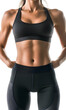 © Oksana_Latysheva - Closeup woman body. Fitness woman showing abs and flat belly isolated on white background
