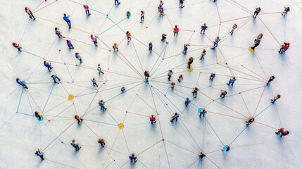 aerial shot of people standing on a large surface, connected by colorful lines, representing social 