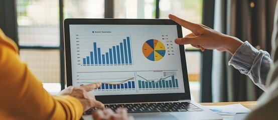 Business Data Analysis Presentation - Team Discussing Charts