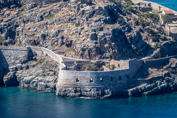 Wall Mural - panoramic view of an ancient fortress in a bay against the backdrop of the sea on a sunny day on the island of Crete in Greece