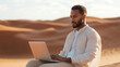 © Anastasiia - Man working on a laptop in the desert. Remote work and digital nomad lifestyle concept. Outdoor workspace.