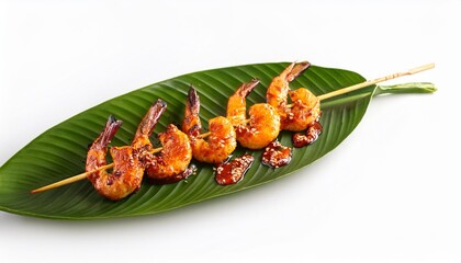 Wall Mural - grilled shrimp skewers on tropical leaf with spicy sauce