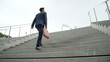 © InfiniteFlow - Top view of smart business man walking up stairs with bag in the hand. Professional project manager climb up the stair and going to workplace. Increasing skill, getting promotion, traveling. Exultant.