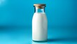 © Mary - a full glass milk bottle with a wooden cap on a blue background