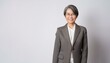 © ochikosan - 60代のスーツを着たアジア人女性のポートレート。（Portrait of an Asian woman in her 60s wearing a suit.）