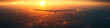 © Dmitry - A solitary glider flying into a vibrant sunset over a vast landscape, evoking a sense of serenity and adventure