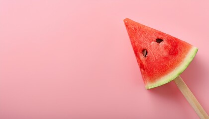 Sticker - juicy watermelon slice on wooden stick isolated on pink background with copy space for summer fruit design