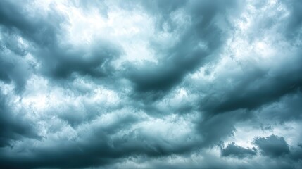Wall Mural - brooding sky with thick gray clouds, stormy weather approaching