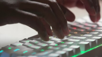 Colorful keyboard and hands typing