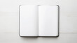 © Imane - open notebook with blank white pages on wooden surface