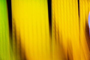 Wall Mural - A blurry image of a yellow background with a green stripe