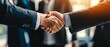 © 为轩 张 - Businessmen Shaking Hands with Blurred Background of Professional Colleagues, Symbolizing Team Collaboration and Success in the Office